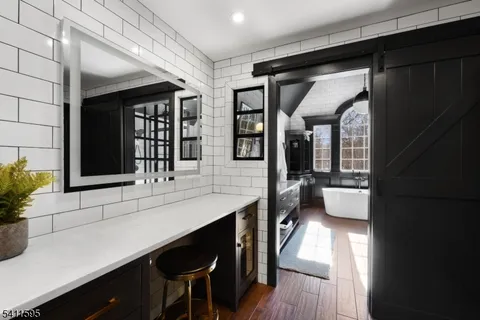 a bathroom with a double vanity sink and mirror