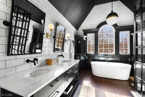 a utility room with sink dryer and washer