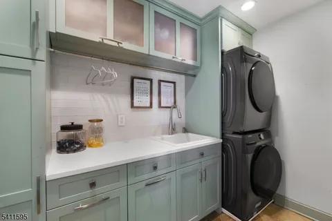 a bathroom with a sink a toilet a mirror and shower