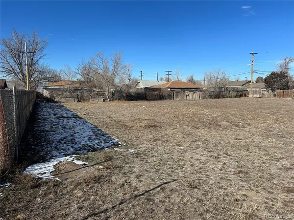 a view of a field with sitting area