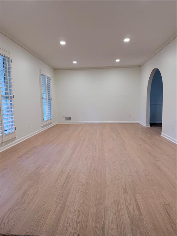 1863 Mt Vernon Road Dunwoody, GA 30338 - Photo 5 of 25 an empty room with wooden floor and windows