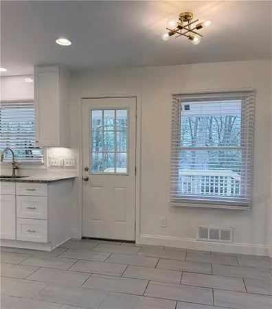 a bathroom with a sink double vanity and a tub