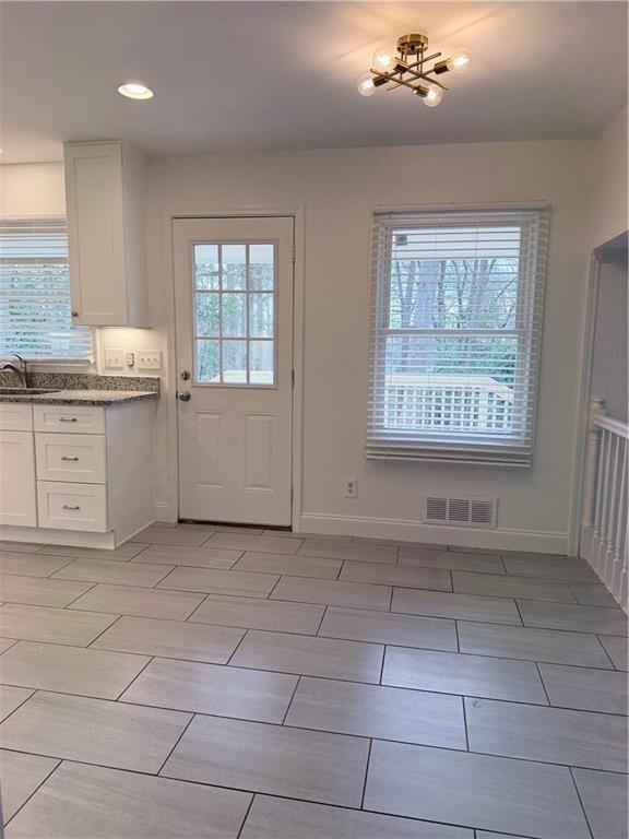 1863 Mt Vernon Road Dunwoody, GA 30338 - Photo 8 of 25 a view of an empty room with a window