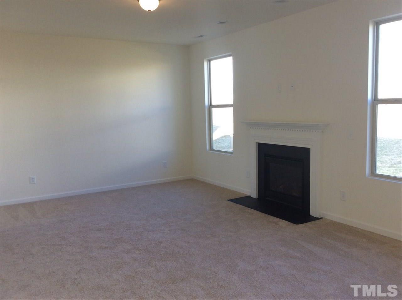 1441 Lombar Street Raleigh, NC 27610 - Photo 6 of 9 an empty room with windows