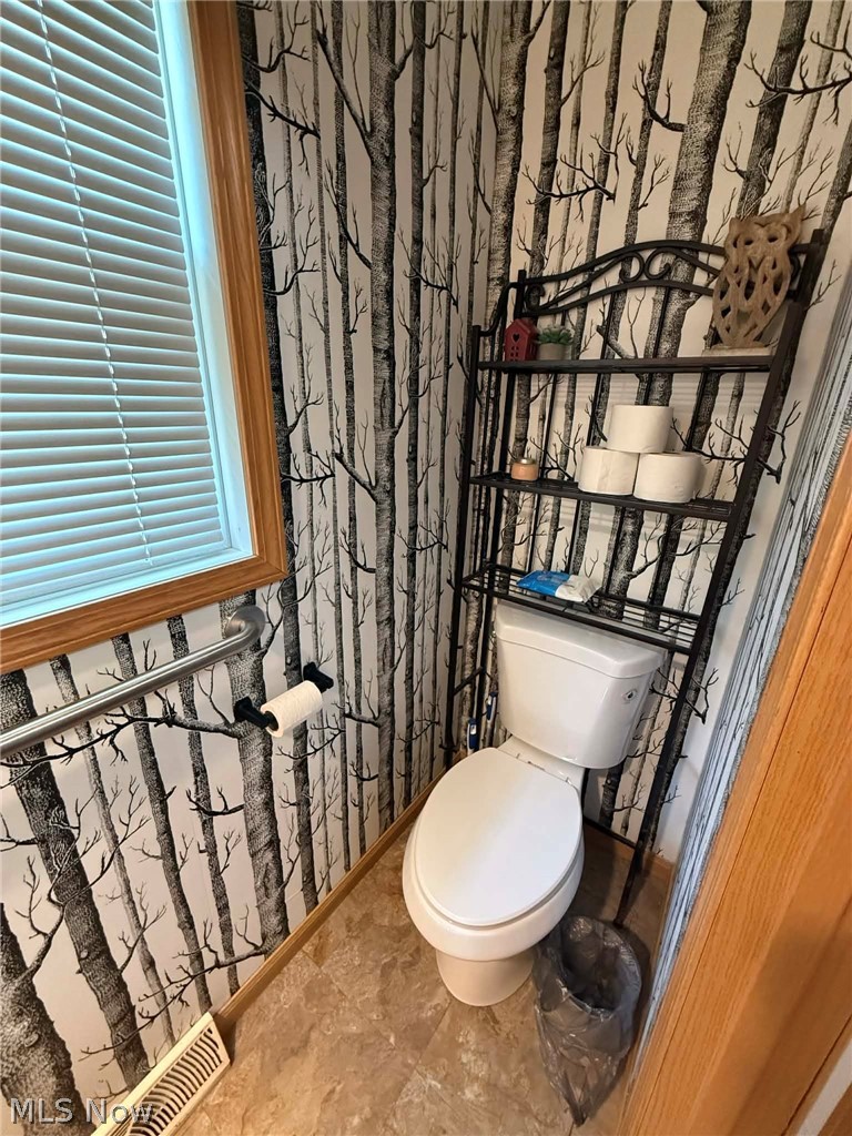 7170 Old Town Road Mount Perry, OH 43760 - Photo 17 of 41 Bathroom with wallpapered walls and toilet