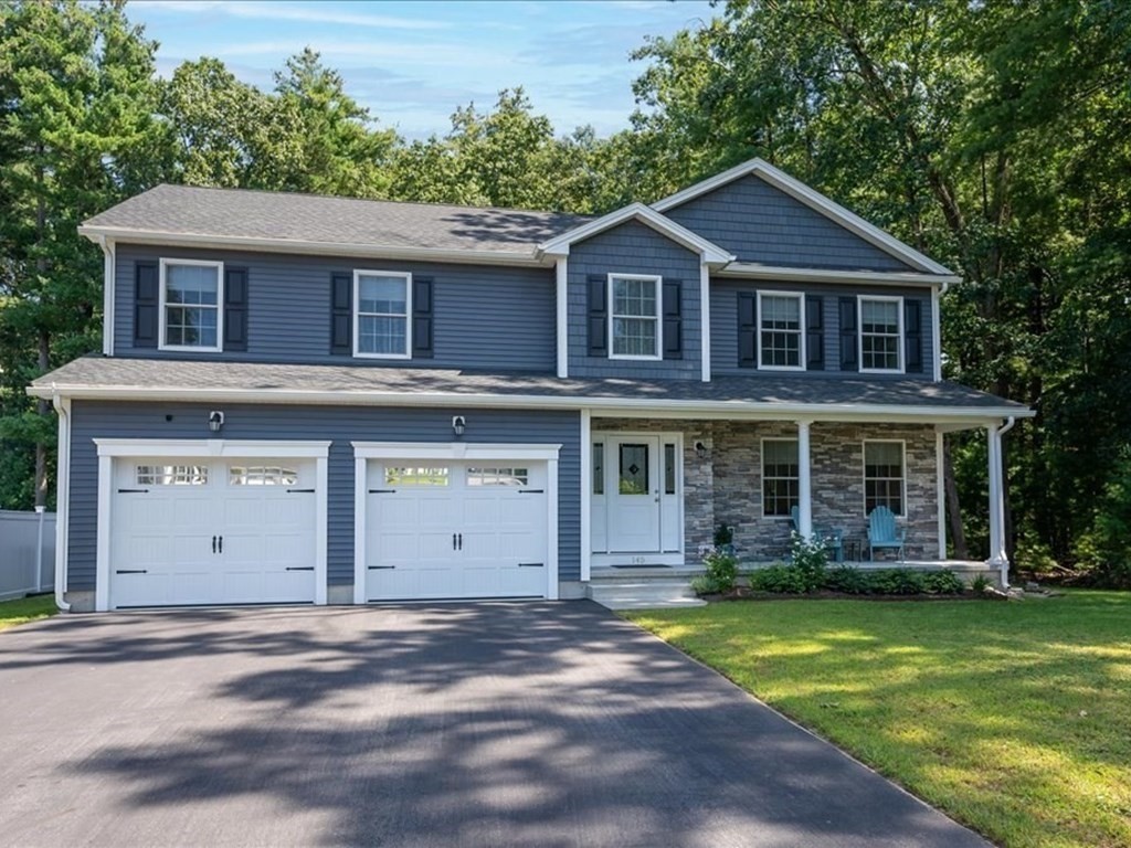 145 Barrington Drive Springfield, MA 01129 - Photo 1 of 42 a front view of a house with a garden and yard