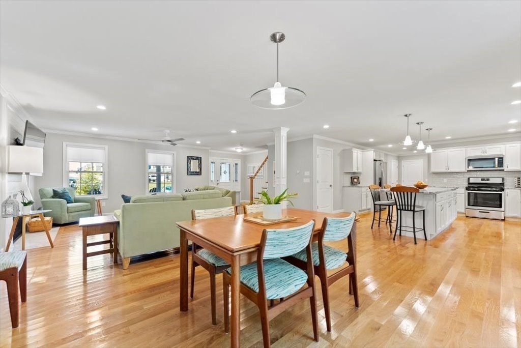145 Barrington Drive Springfield, MA 01129 - Photo 13 of 42 a dining room with furniture a chandelier and wooden floor