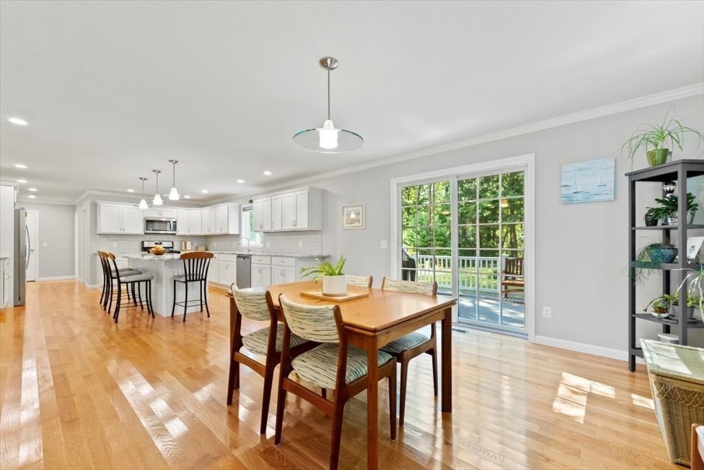 145 Barrington Drive Springfield, MA 01129 - Photo 14 of 42 a dining room with furniture a rug and a floor to ceiling window