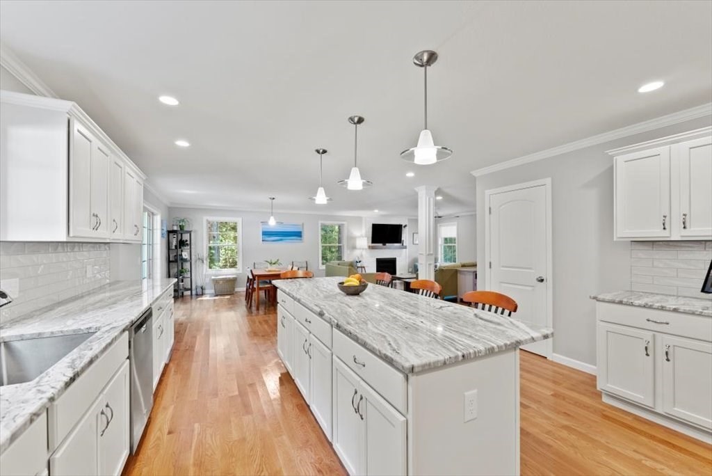 145 Barrington Drive Springfield, MA 01129 - Photo 19 of 42 a large kitchen with kitchen island a large counter space a sink appliances and cabinets