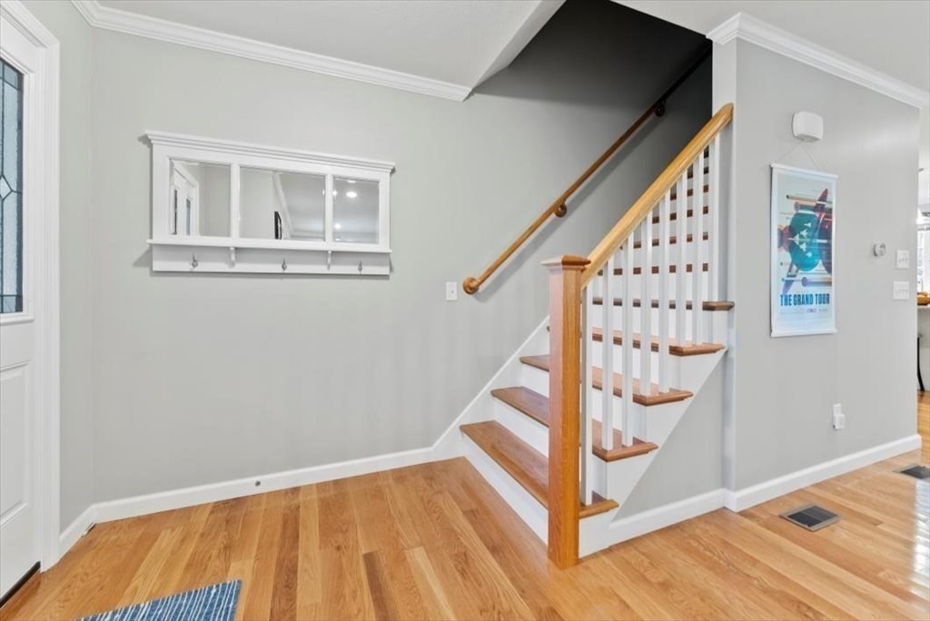 145 Barrington Drive Springfield, MA 01129 - Photo 22 of 42 a view of entryway with wooden floor and stairs