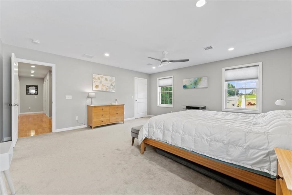 145 Barrington Drive Springfield, MA 01129 - Photo 25 of 42 a spacious bedroom with a bed and a couch