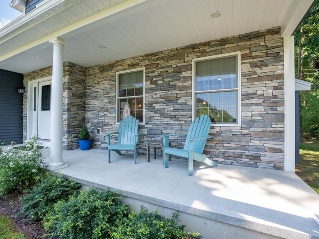 145 Barrington Drive Springfield, MA 01129 - Photo 3 of 42 a front view of a house with outdoor seating