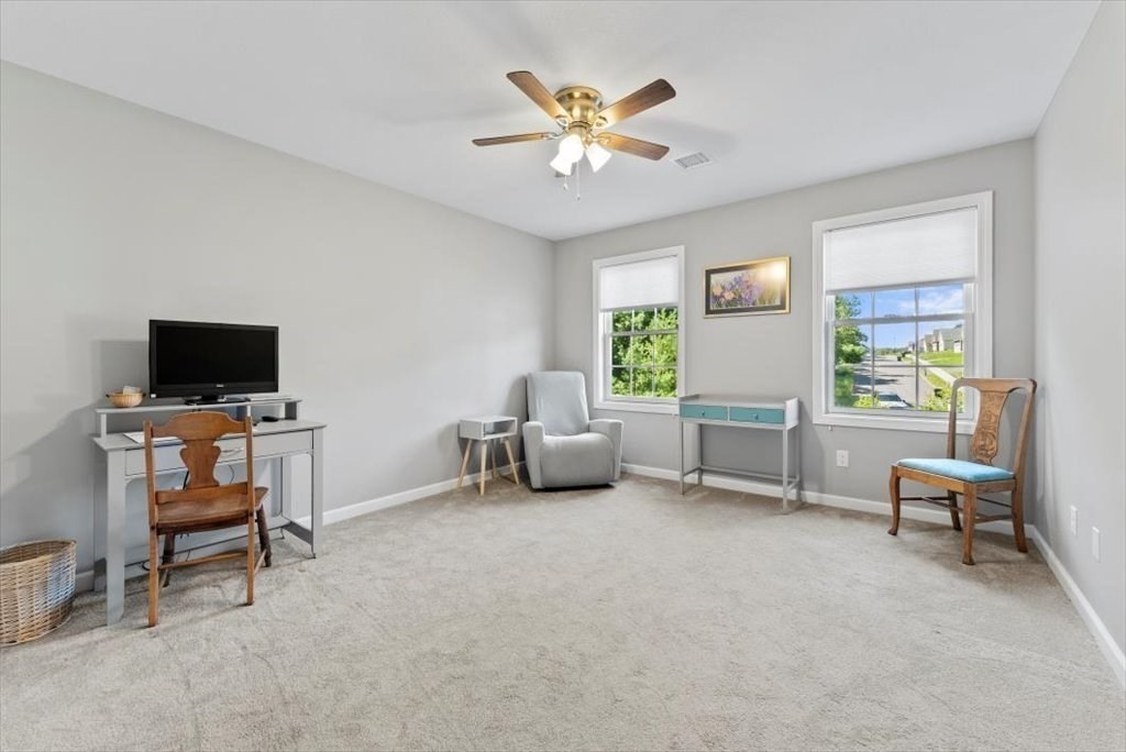 145 Barrington Drive Springfield, MA 01129 - Photo 32 of 42 a living room with furniture and a flat screen tv