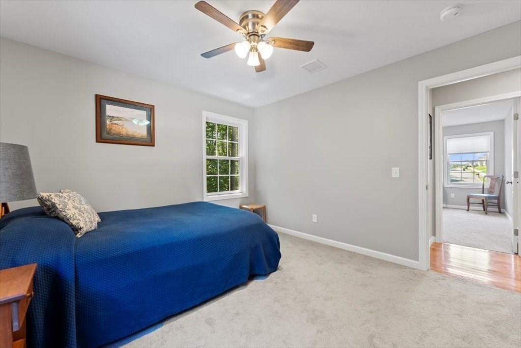145 Barrington Drive Springfield, MA 01129 - Photo 35 of 42 a bedroom with a bed and a chandelier