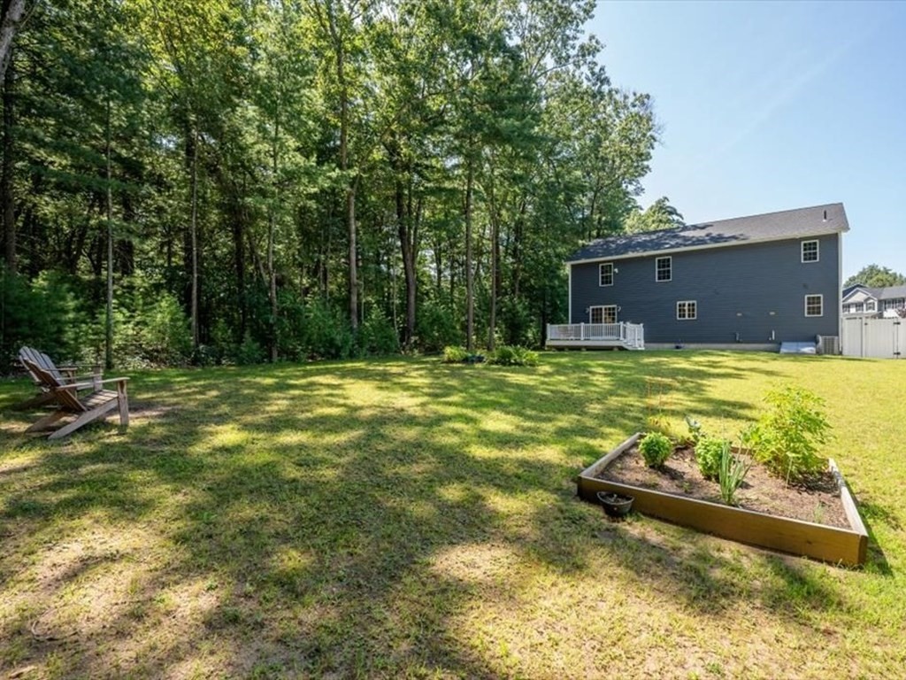 145 Barrington Drive Springfield, MA 01129 - Photo 41 of 42 a swimming pool with lawn chairs and large trees