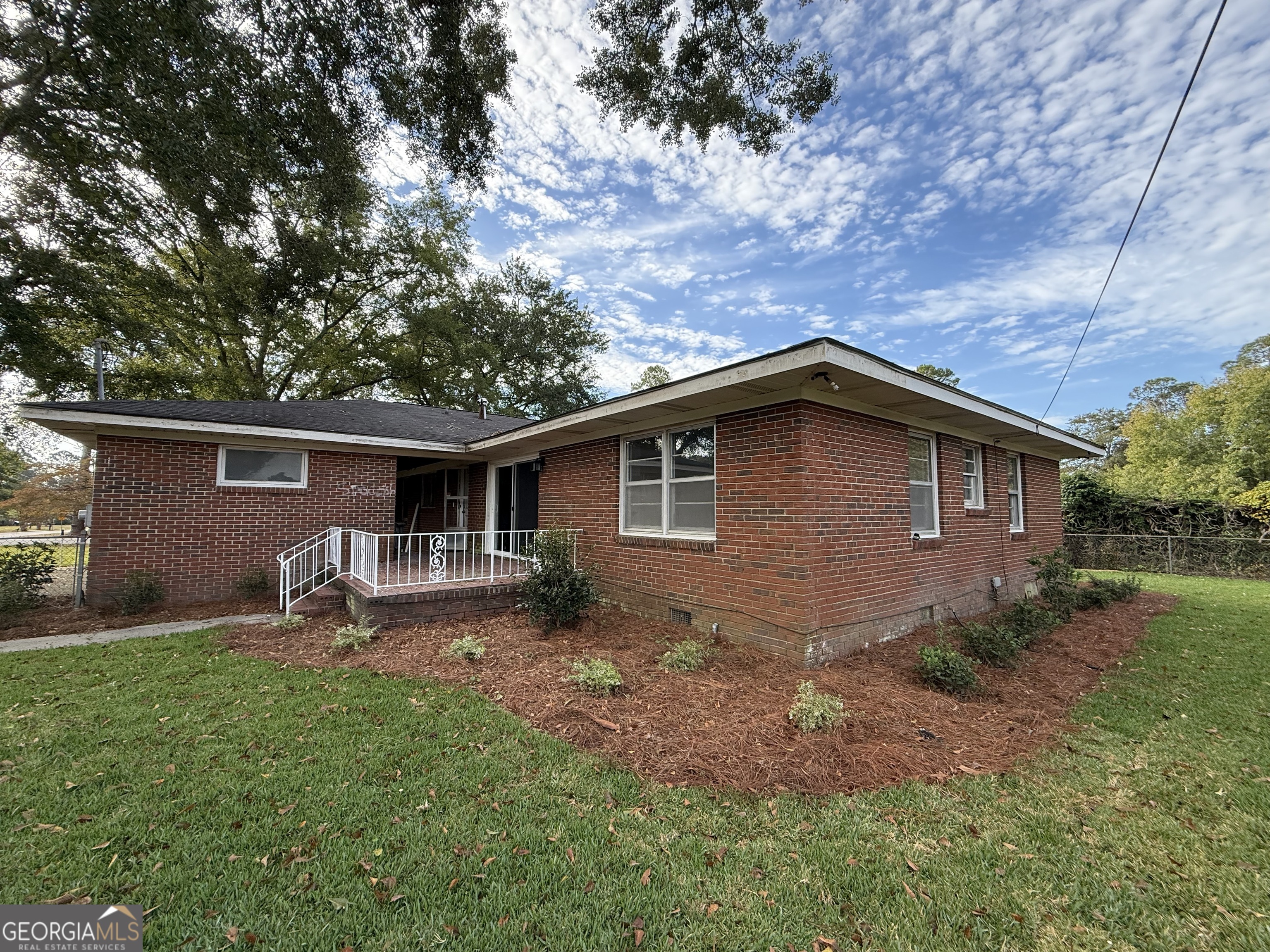 412 Roberson Street Dublin, GA 31021 - Photo 14 of 67 a backyard of a house with seating space