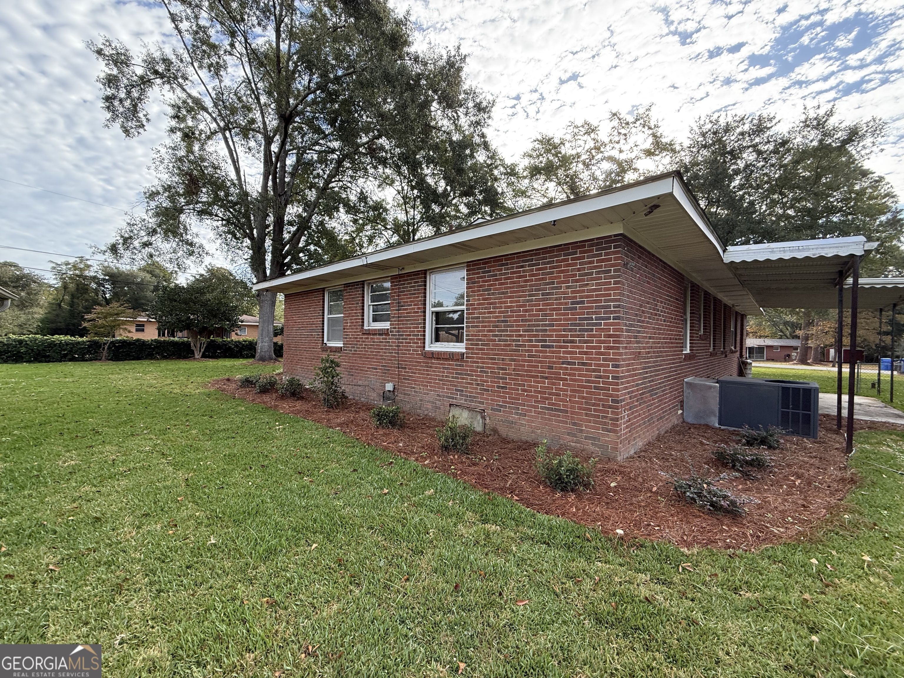 412 Roberson Street Dublin, GA 31021 - Photo 15 of 67 a backyard of a house with lots of green space