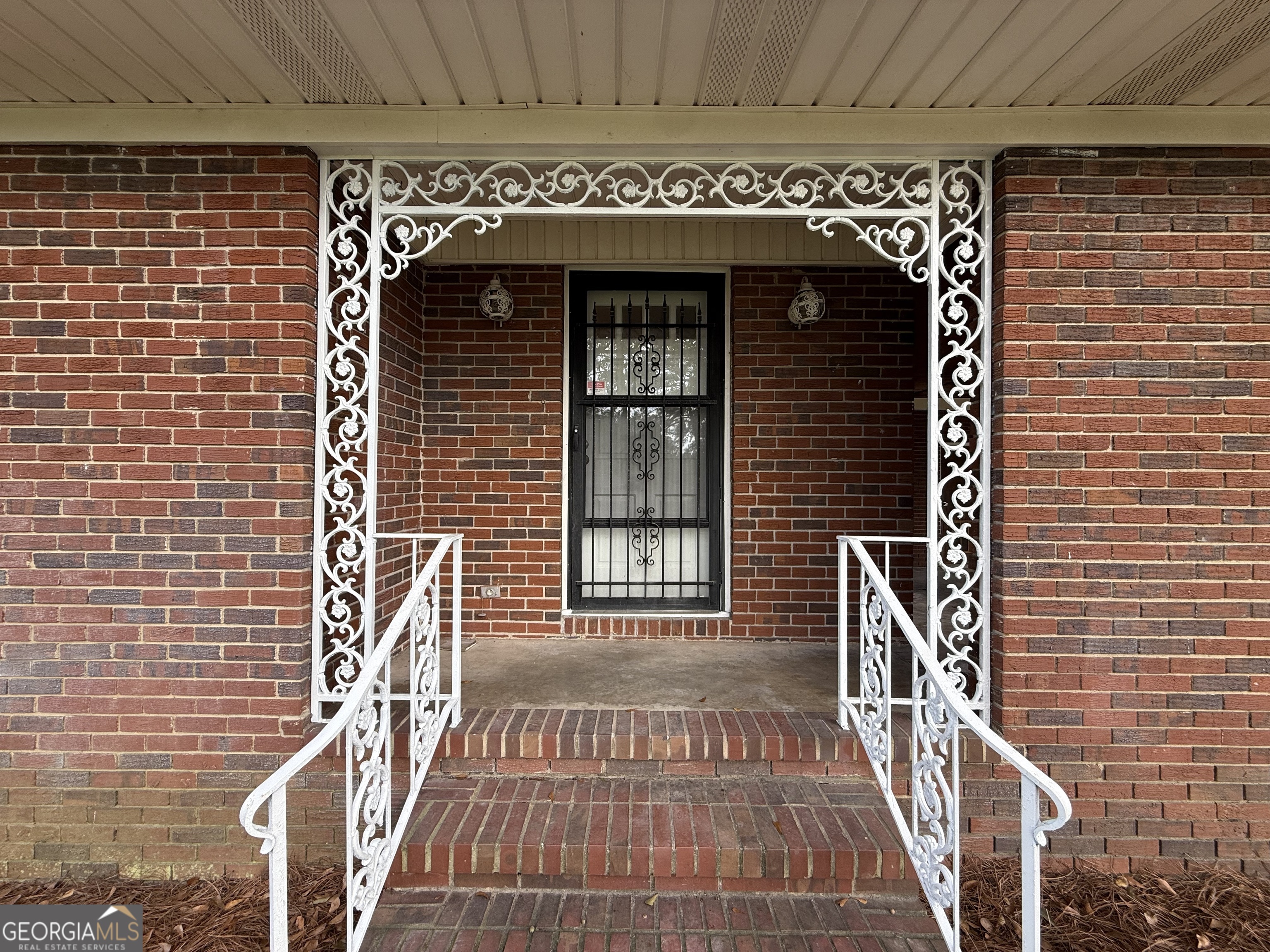412 Roberson Street Dublin, GA 31021 - Photo 22 of 67 a front view of a building with glass door