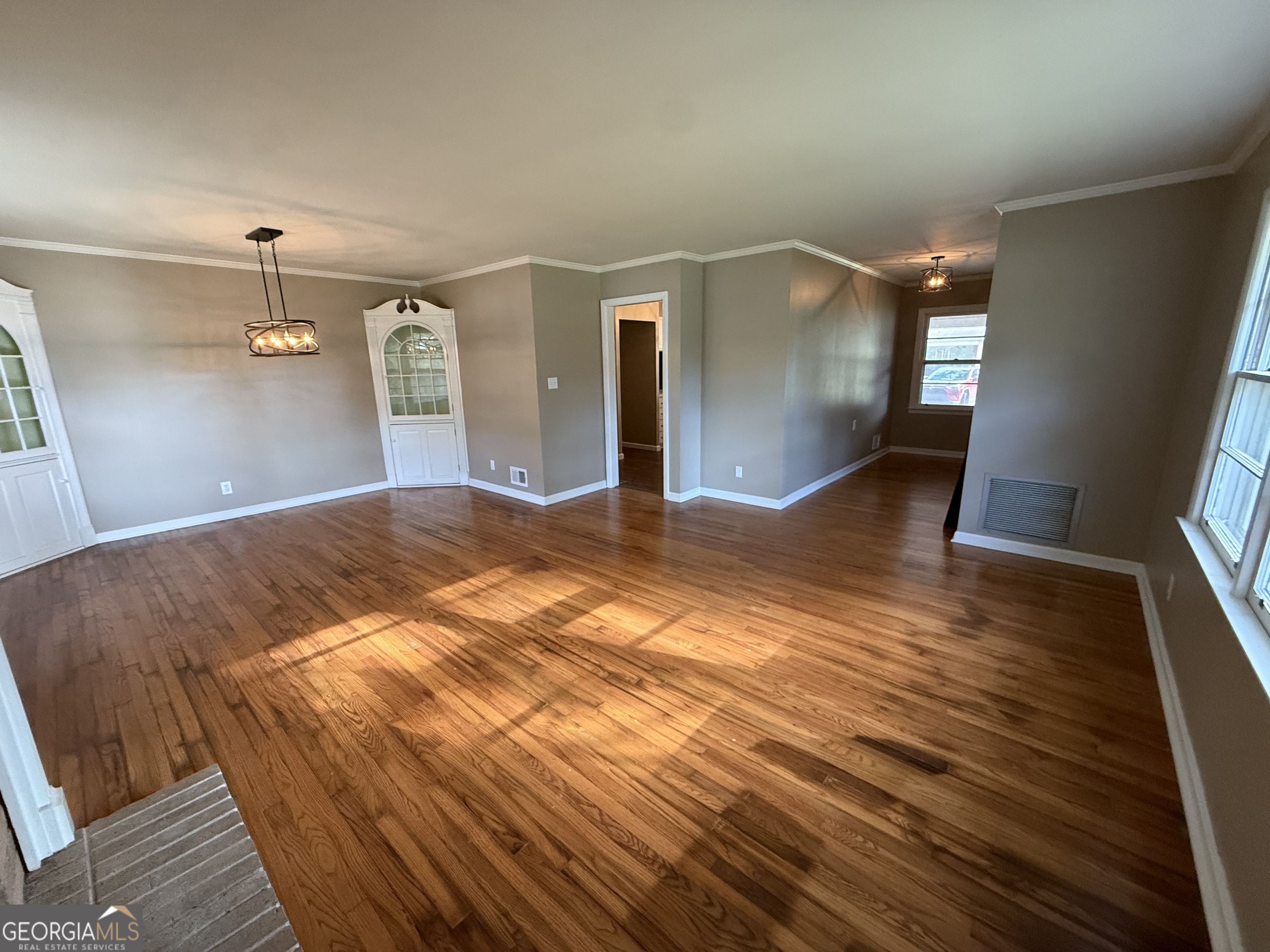 412 Roberson Street Dublin, GA 31021 - Photo 26 of 67 a bedroom with a bed and a mirror