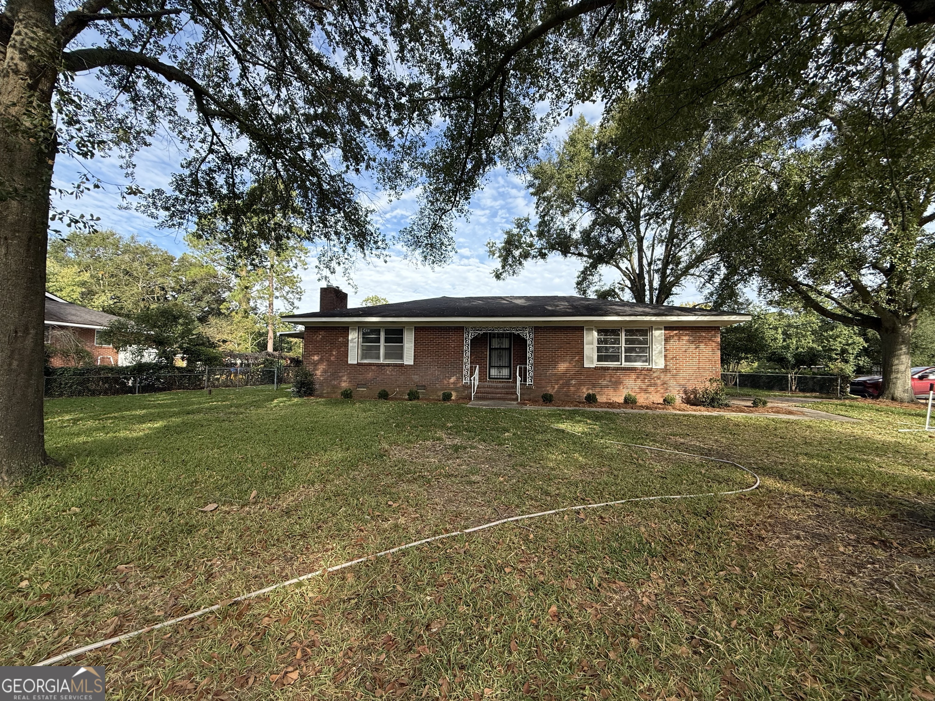 412 Roberson Street Dublin, GA 31021 - Photo 3 of 67 a front view of a house with a yard