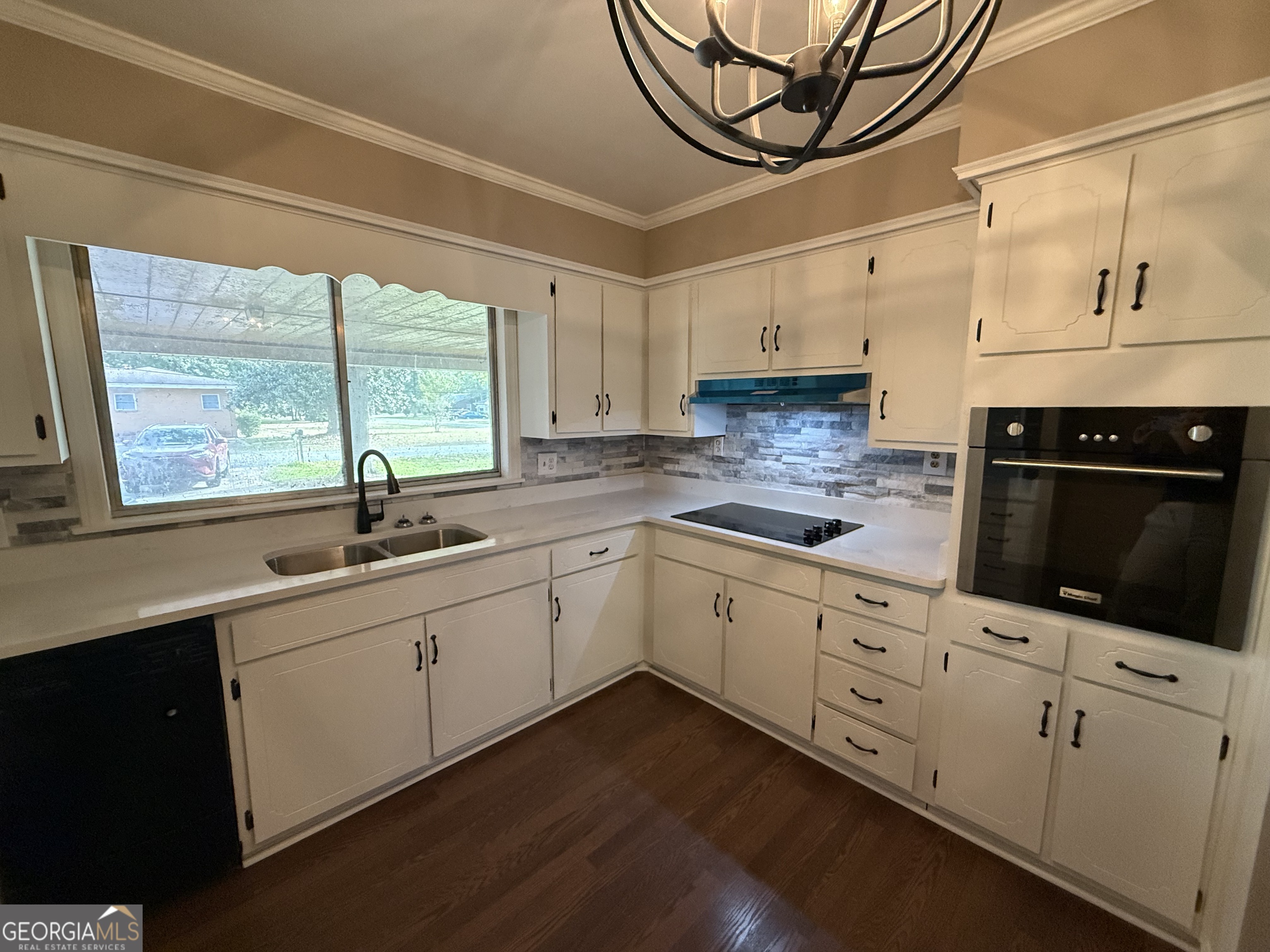 412 Roberson Street Dublin, GA 31021 - Photo 33 of 67 a kitchen with sink cabinets and window