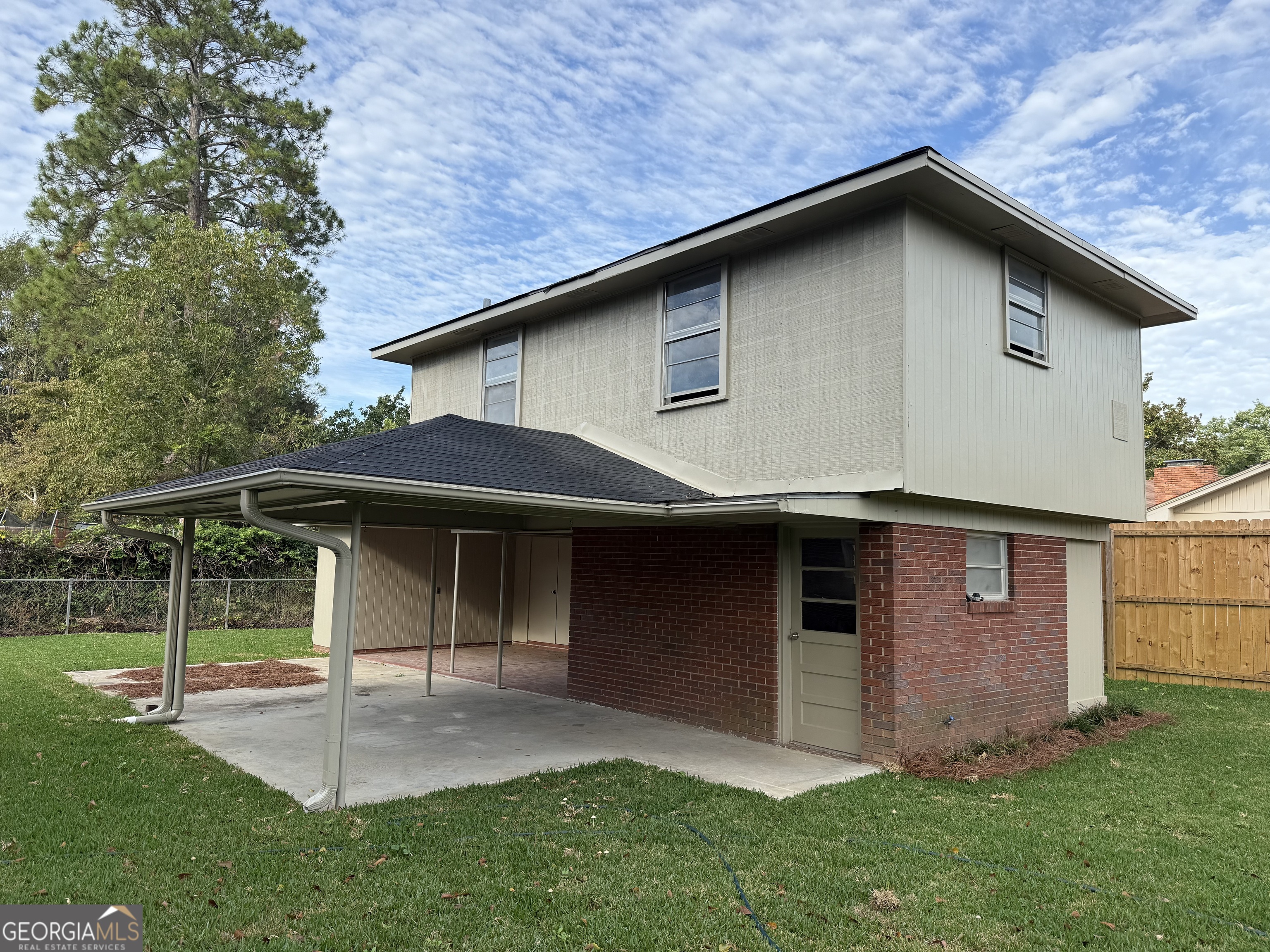 412 Roberson Street Dublin, GA 31021 - Photo 49 of 67 a front view of a house with a yard