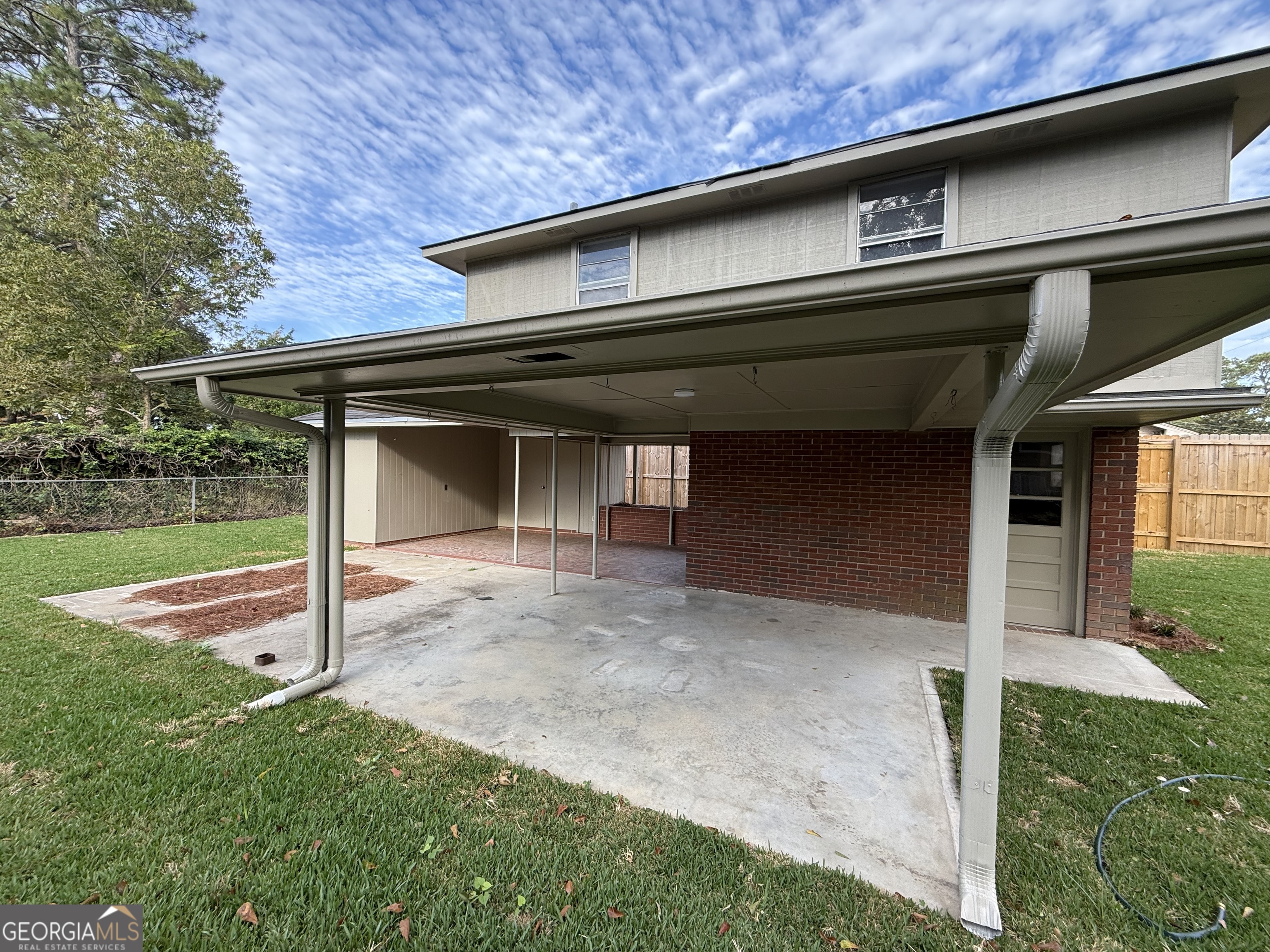 412 Roberson Street Dublin, GA 31021 - Photo 50 of 67 a front view of a house with garden