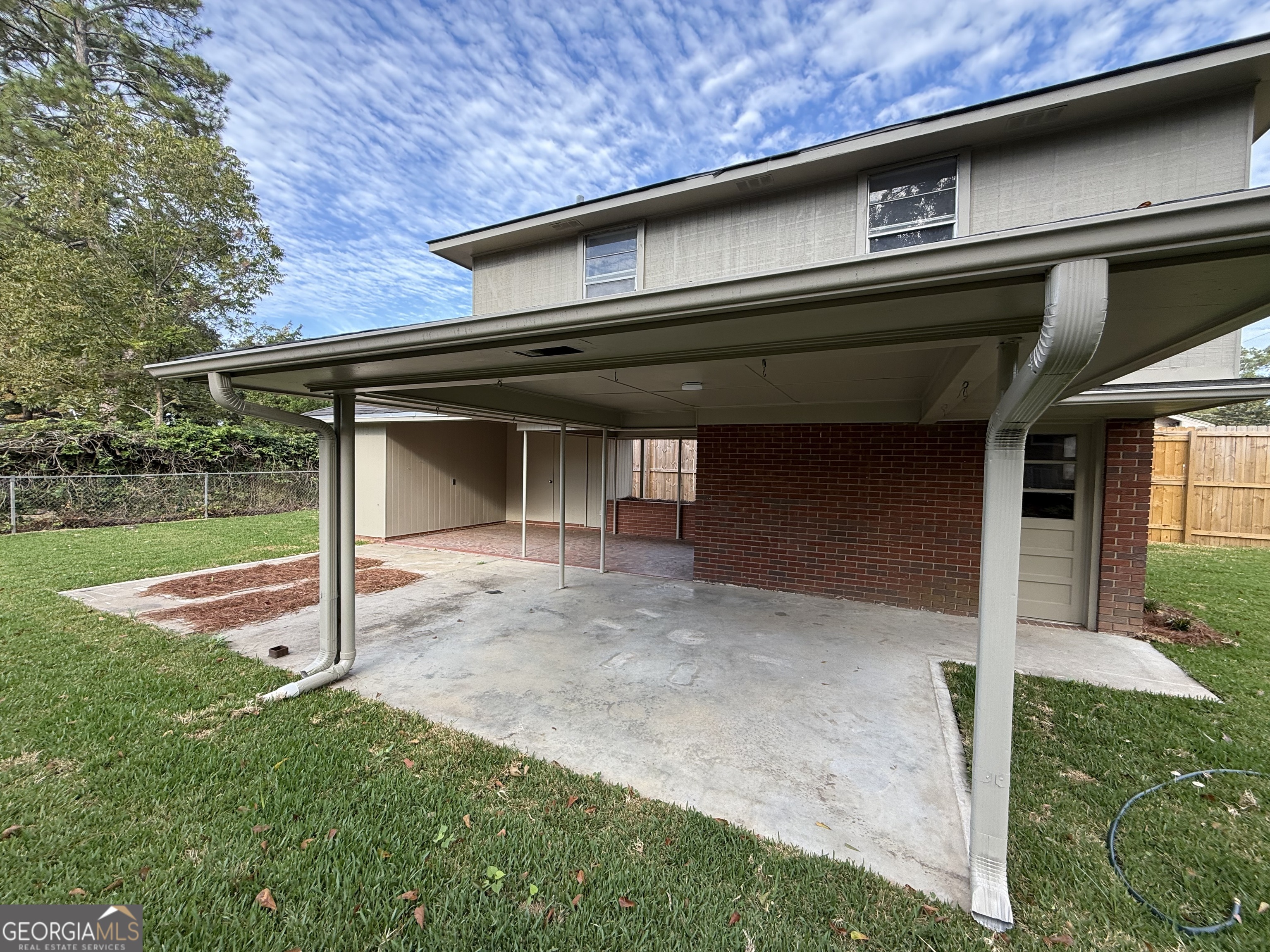 412 Roberson Street Dublin, GA 31021 - Photo 51 of 67 a view of a house with a small yard