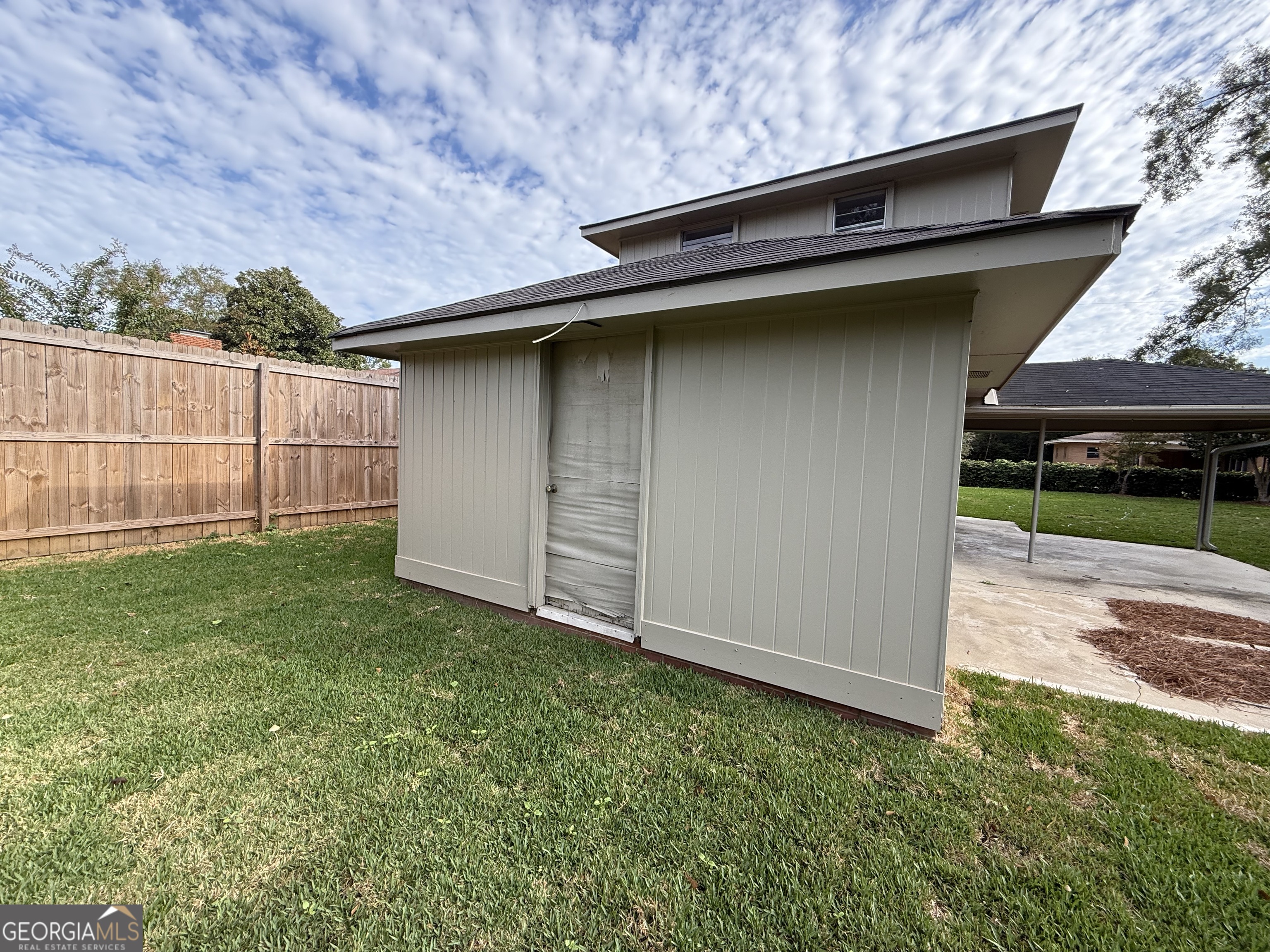412 Roberson Street Dublin, GA 31021 - Photo 54 of 67 a backyard of a house with lots of green space