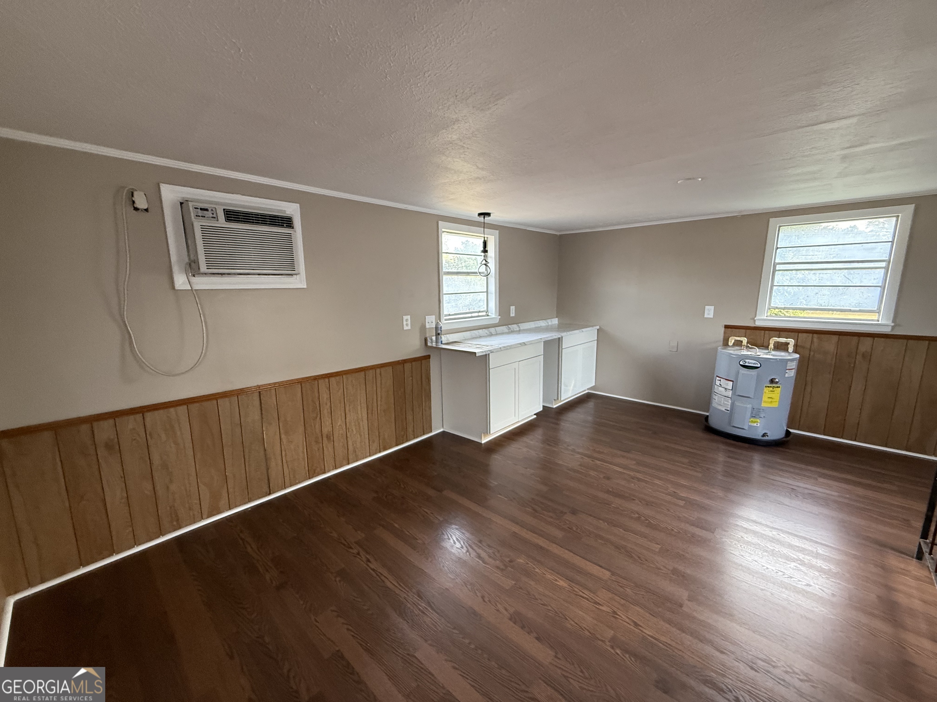 412 Roberson Street Dublin, GA 31021 - Photo 62 of 67 a view of an empty room with window and wooden floor