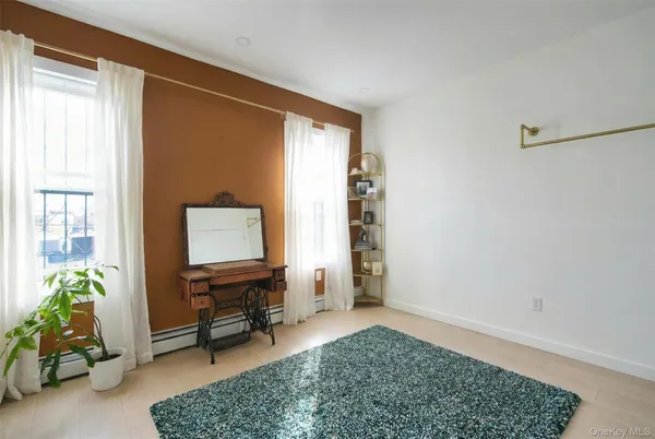 a view of workspace with furniture and window