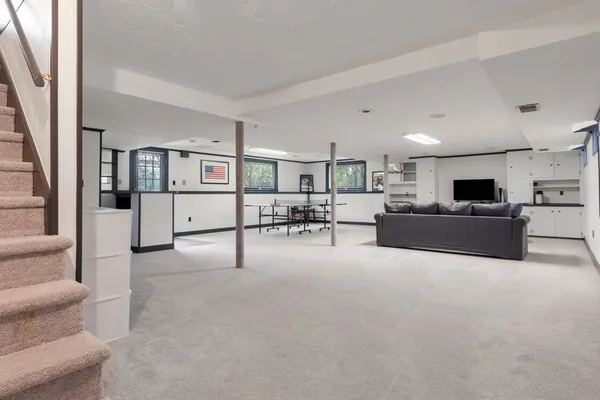 a view of a livingroom with furniture and a flat screen tv