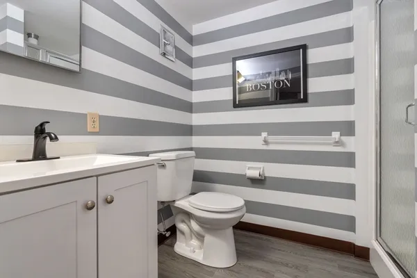 a bathroom with a toilet and a sink