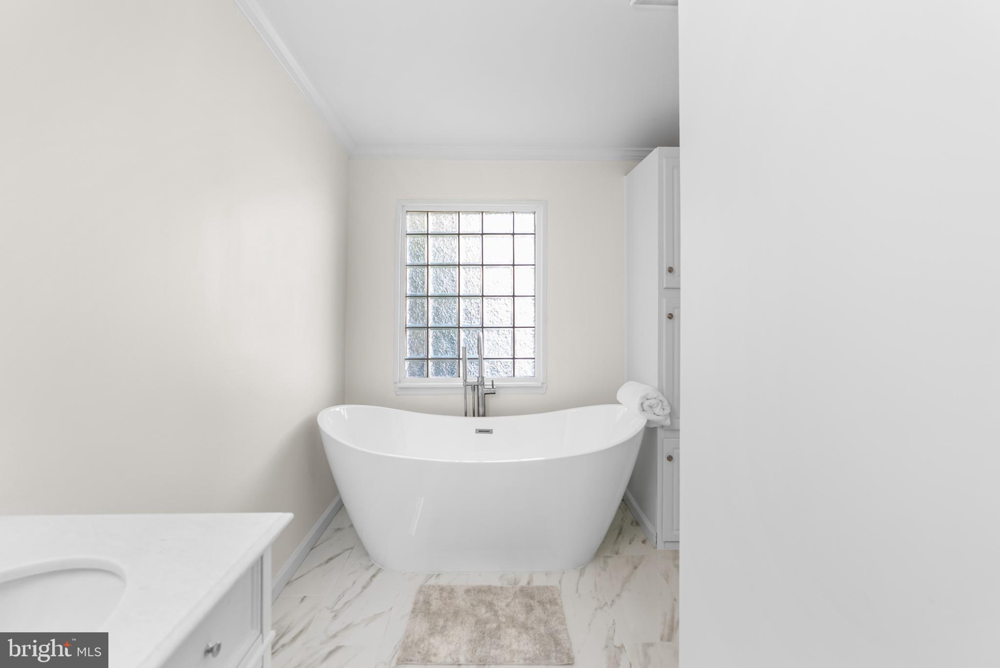 6430 Fourteenth Street Alexandria, VA 22307 - Photo 14 of 55 Serene bathroom with elegant freestanding tub.
