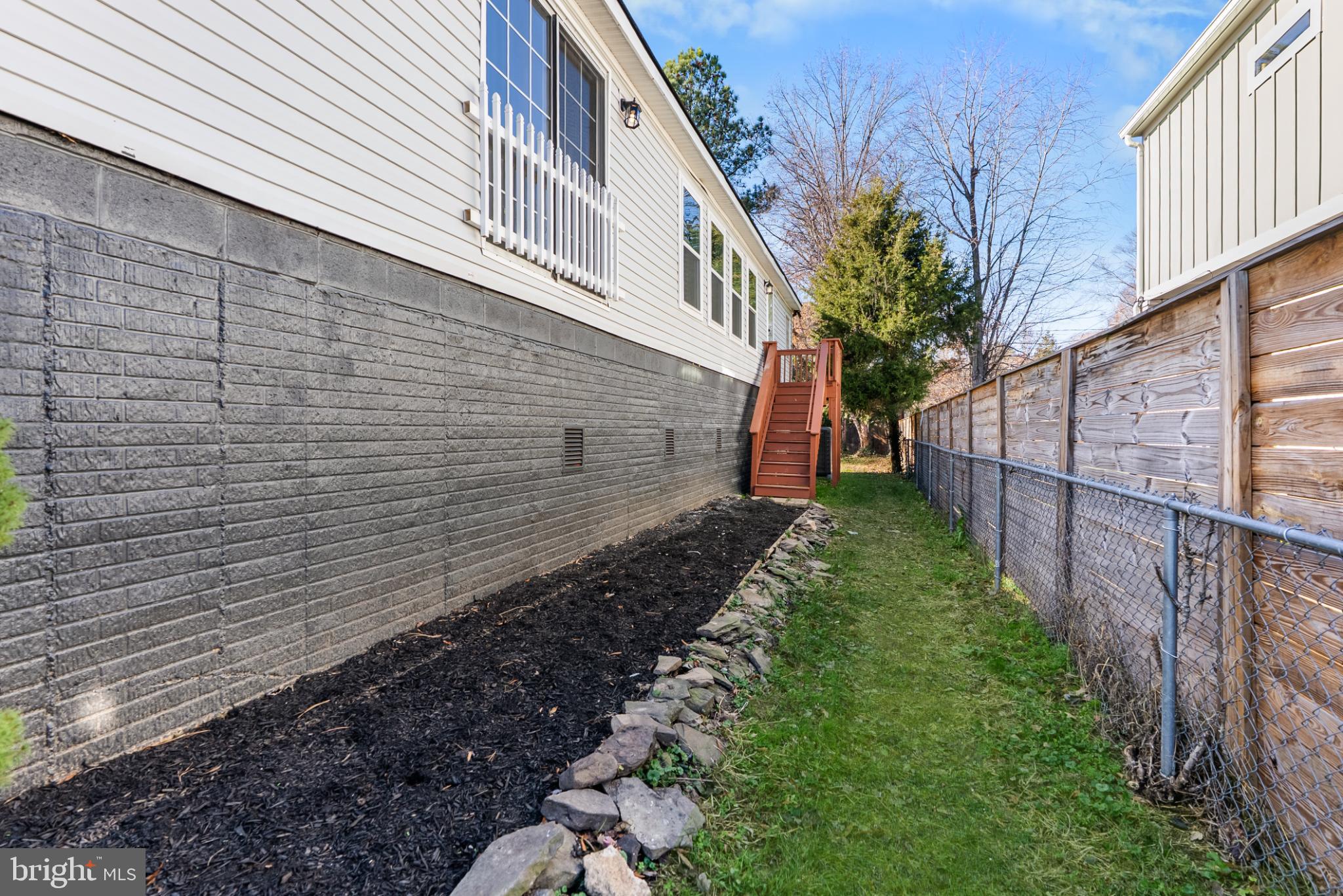 6430 Fourteenth Street Alexandria, VA 22307 - Photo 51 of 55 Charming side yard with lush greenery.