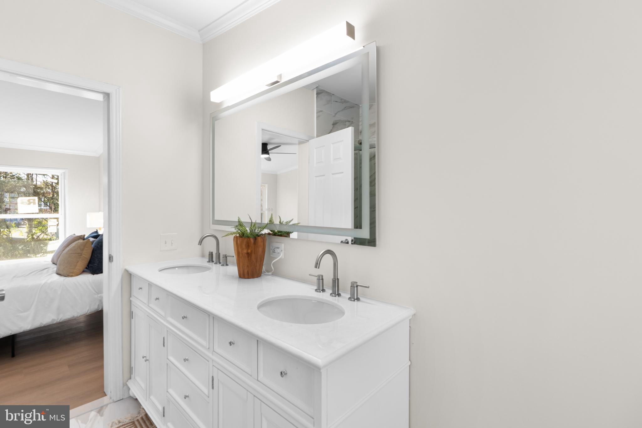 6430 Fourteenth Street Alexandria, VA 22307 - Photo 10 of 55 Elegant dual-sink bathroom oasis.