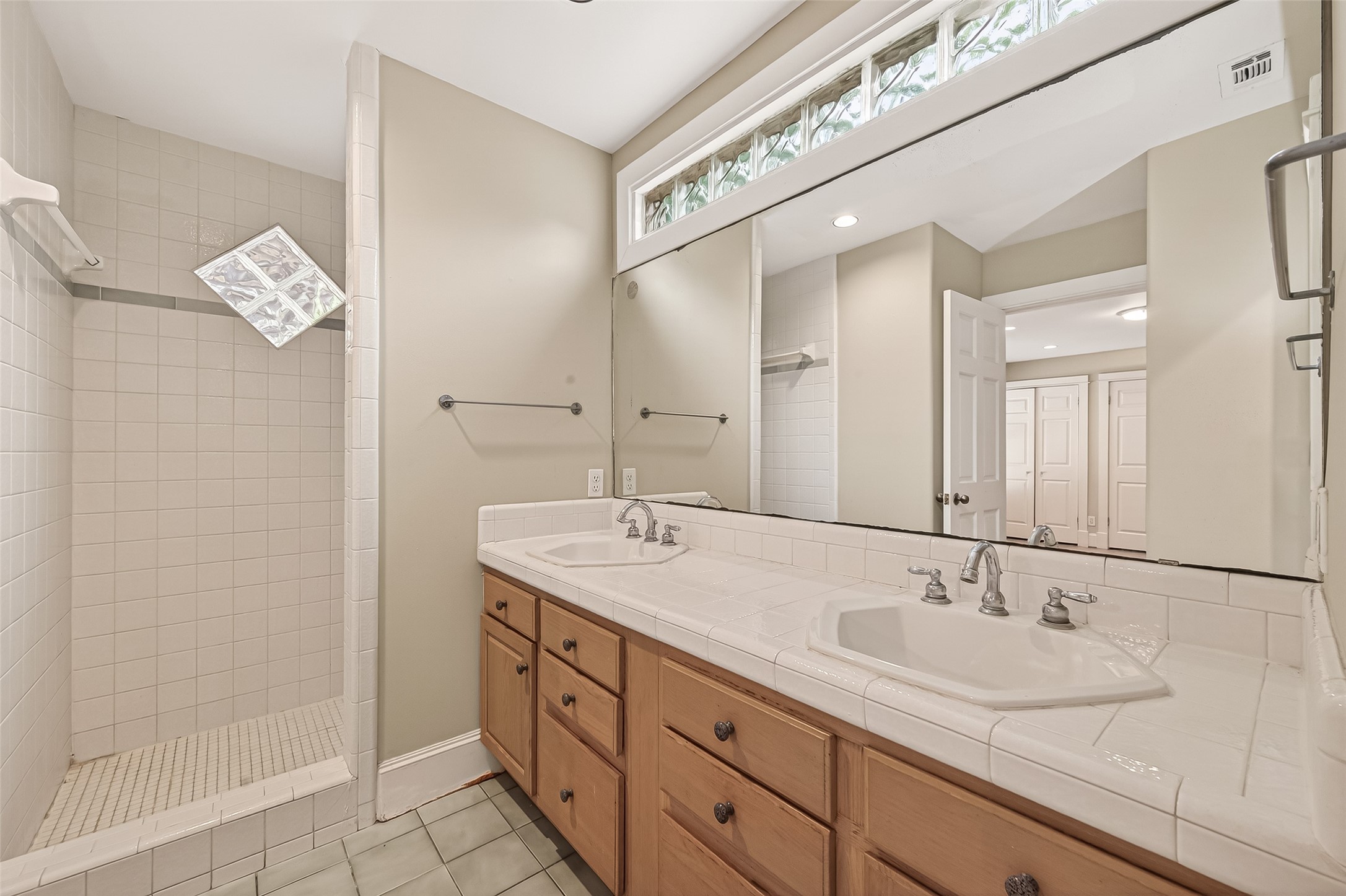 1807 Crocker Street, Unit A Houston, TX 77006 - Photo 20 of 37 Big vanity with two sinks and a lot of storage area. You can see the large shower in the background.