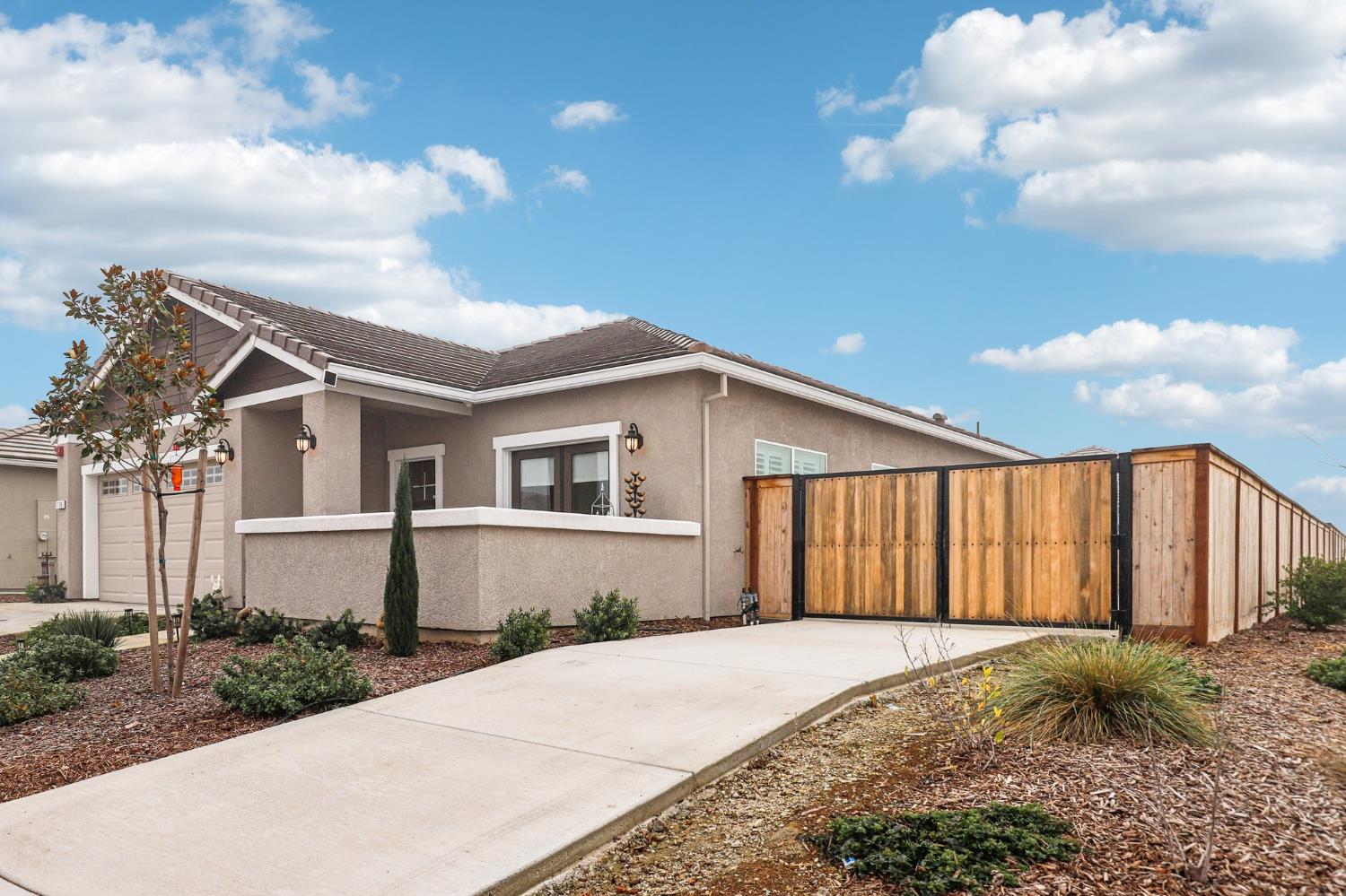 a front view of a house with garden