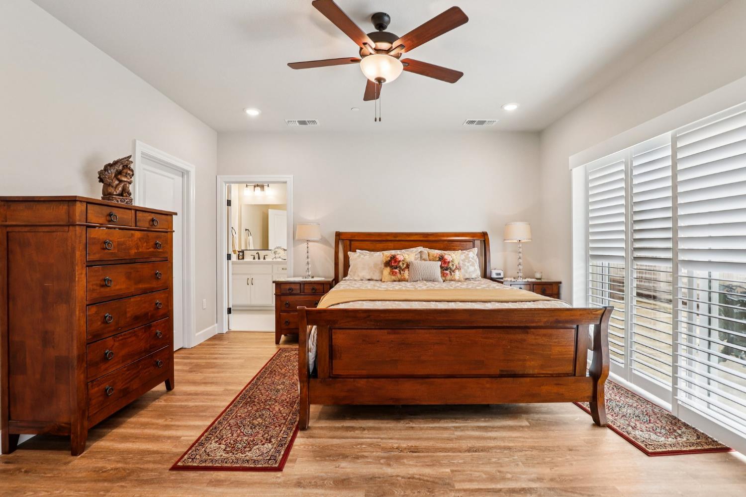 1124 North Palmer Road Galt, CA 95632 - Photo 18 of 41 a bedroom with a bed and a cabinets