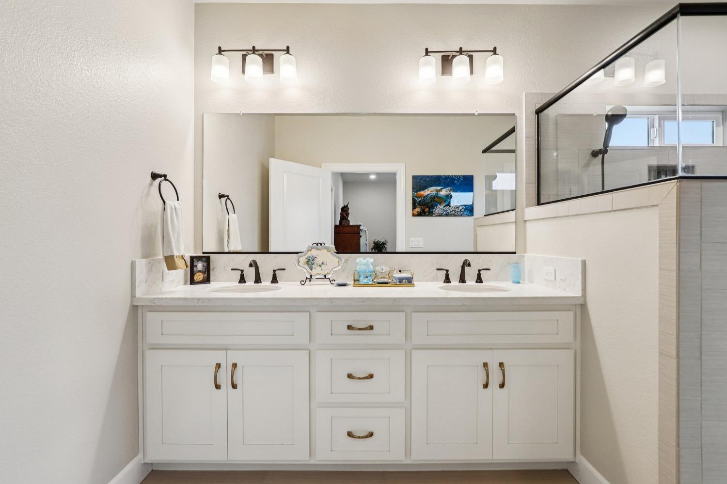 1124 North Palmer Road Galt, CA 95632 - Photo 22 of 41 a bathroom with a sink vanity and mirror