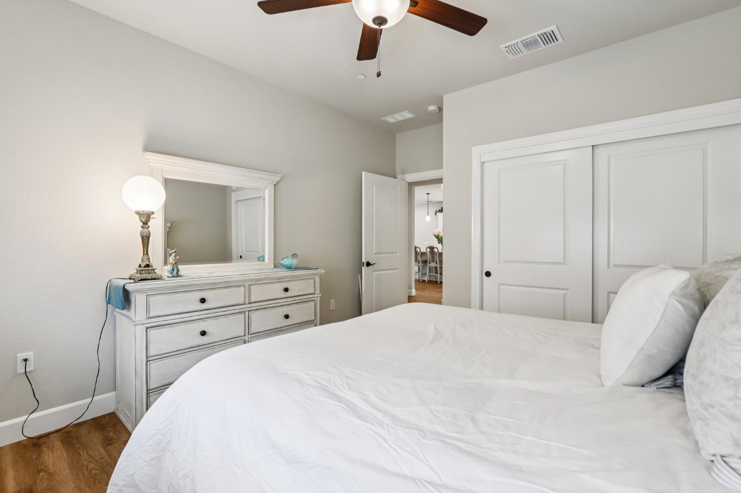 1124 North Palmer Road Galt, CA 95632 - Photo 25 of 41 a bedroom with a bed and a chandelier