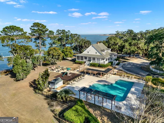 a view of a city with lawn chairs and a potted plant