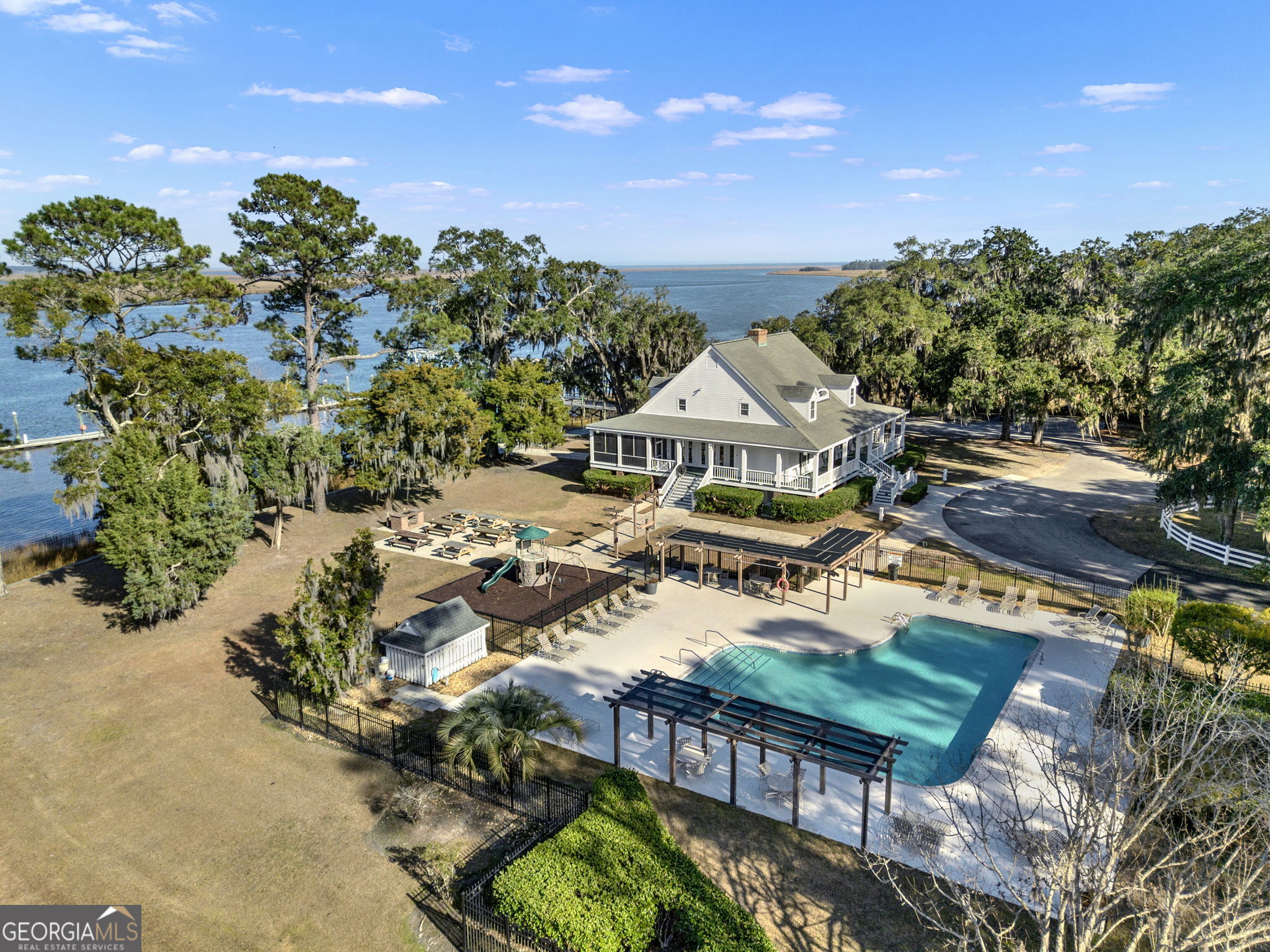 Lot 138 Sapelo Circle Townsend, GA 31331 - Photo 13 of 29 a view of a city with lawn chairs and a potted plant