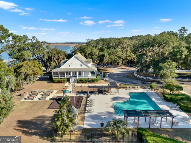 a view of a house with outdoor space and sitting area