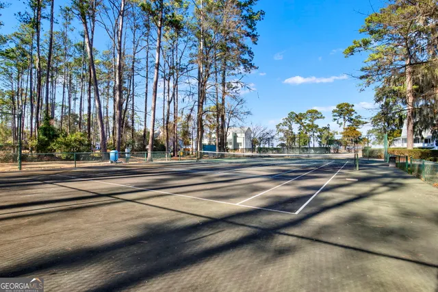 a view of a house with backyard porch and sitting area