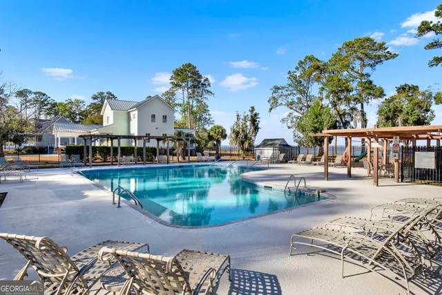 a view of a swimming pool with a patio