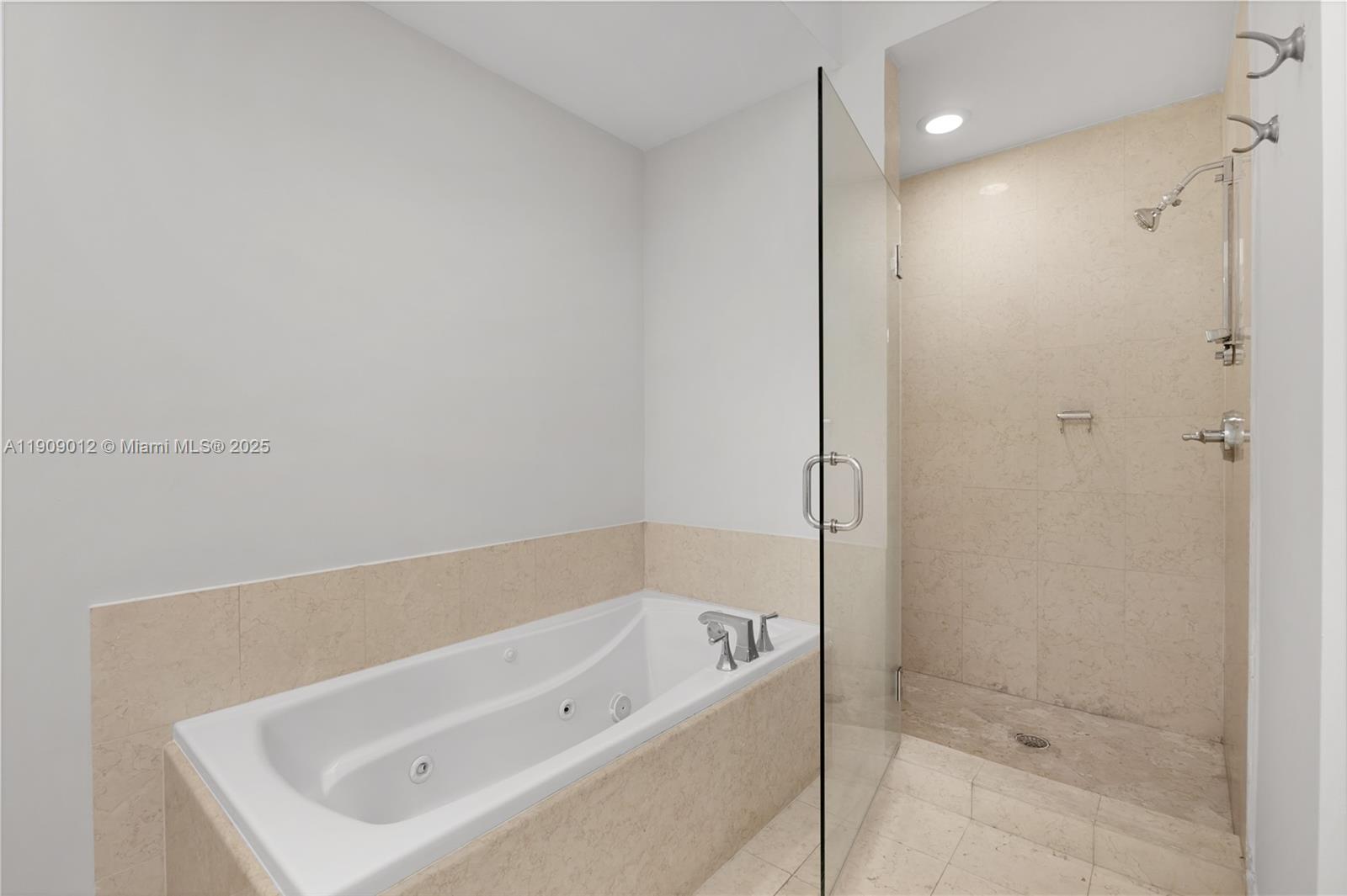 19900 East Country Club Drive, Unit PH18 Aventura, FL 33180 - Photo 16 of 45 a bathroom with a tub shower and vanity