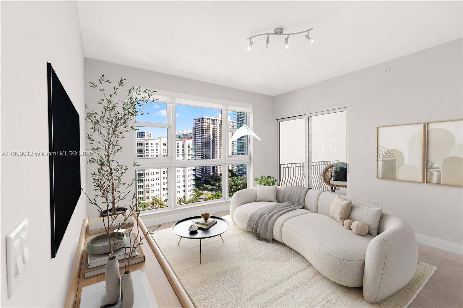 19900 East Country Club Drive, Unit PH18 Aventura, FL 33180 - Photo 7 of 45 a living room with furniture and a large window