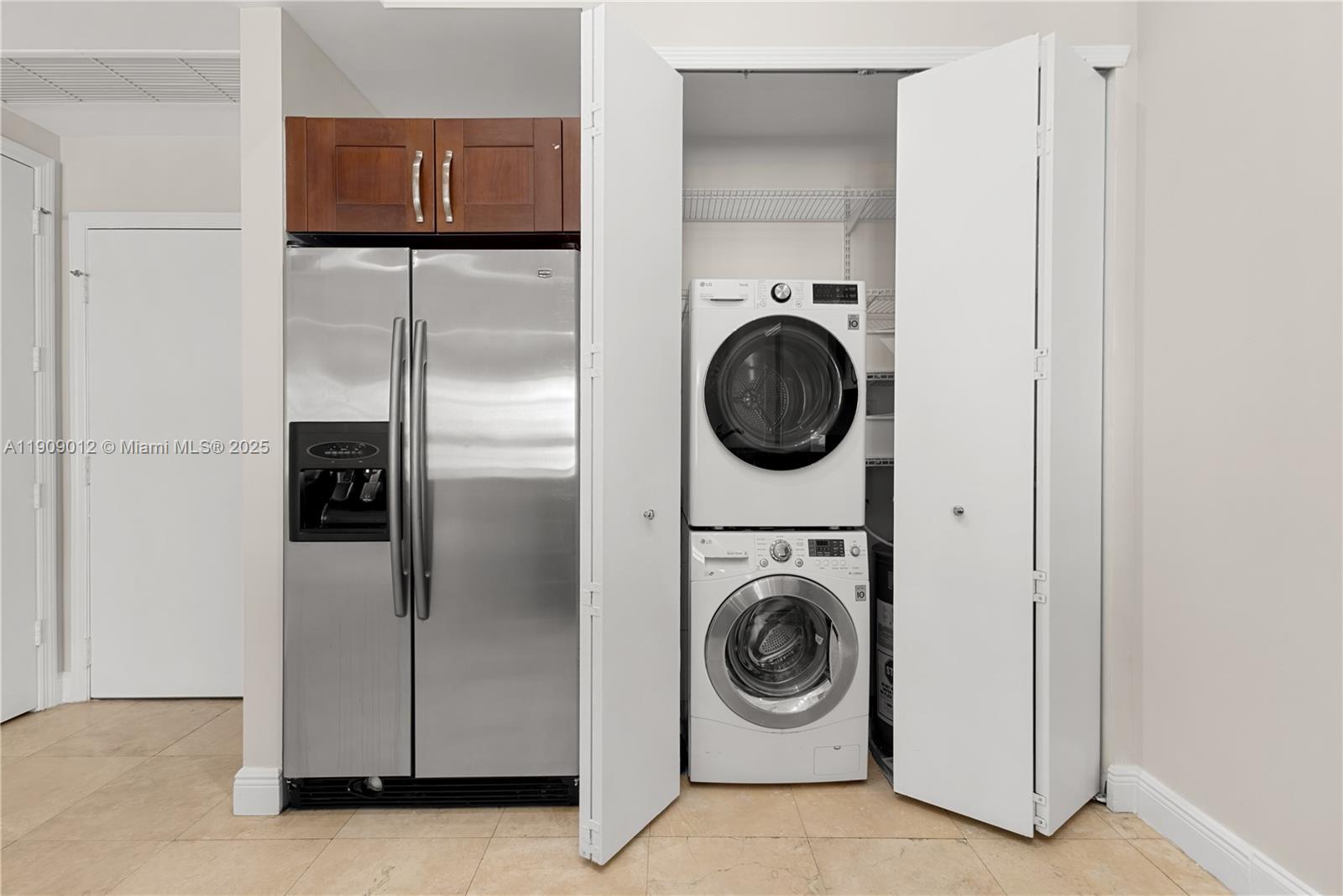 19900 East Country Club Drive, Unit PH18 Aventura, FL 33180 - Photo 10 of 45 a utility room with dryer and washer