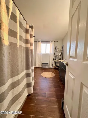a bathroom with a double vanity sink and a mirror
